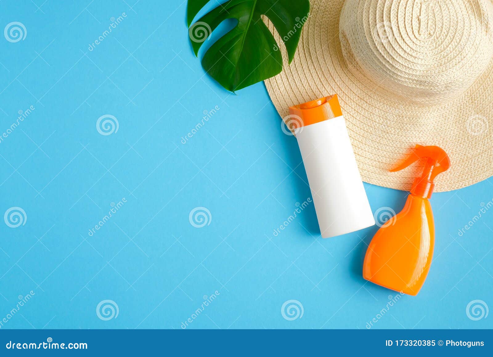 Suntan or Sunblock Lotions Packages on Blue Background with Beach Hat ...