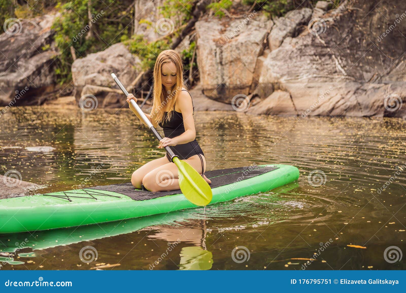 SUP Stand Up Paddle Board Woman Paddle Boarding on Lake Standing Happy ...