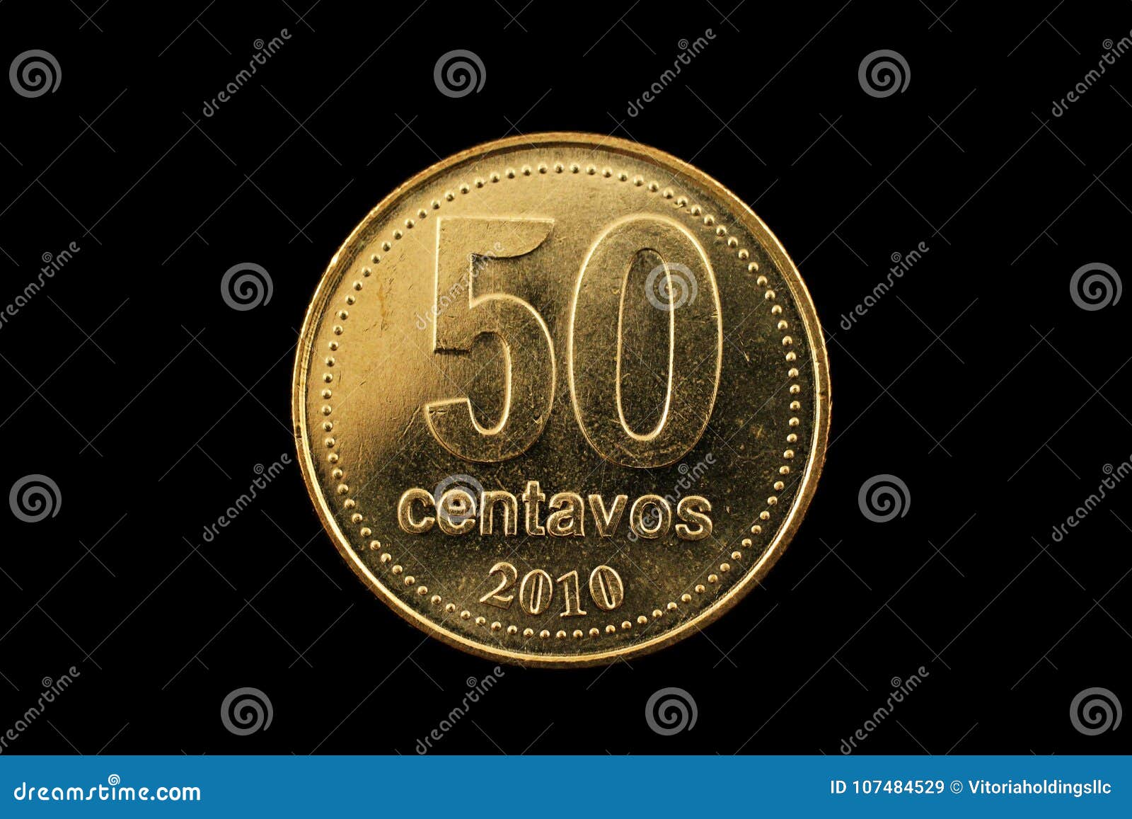argentine gold fifty centavo coin  on black