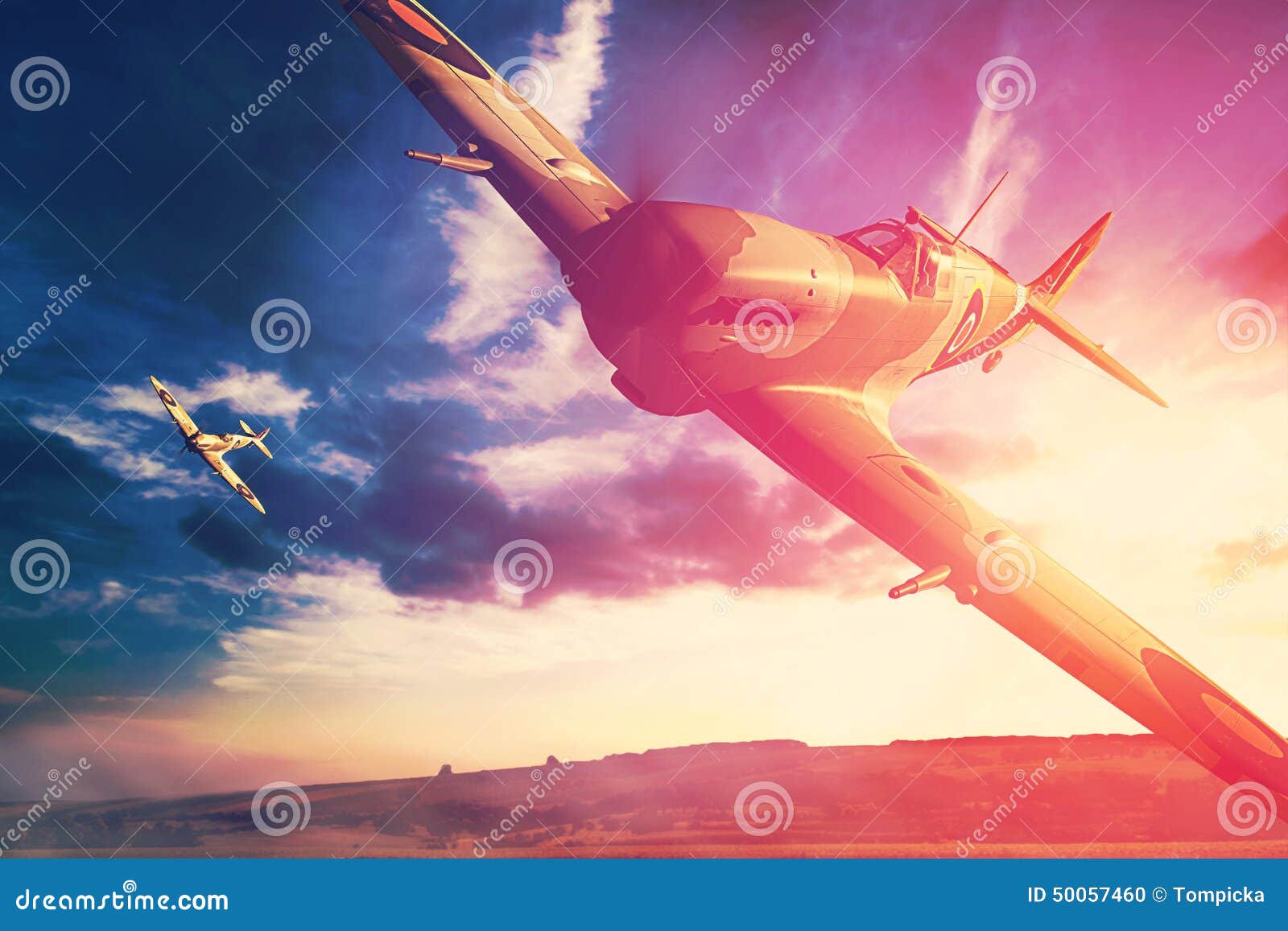 Supermarine Spitfire in Fligjt with Clouds during Sunset Stock Photo