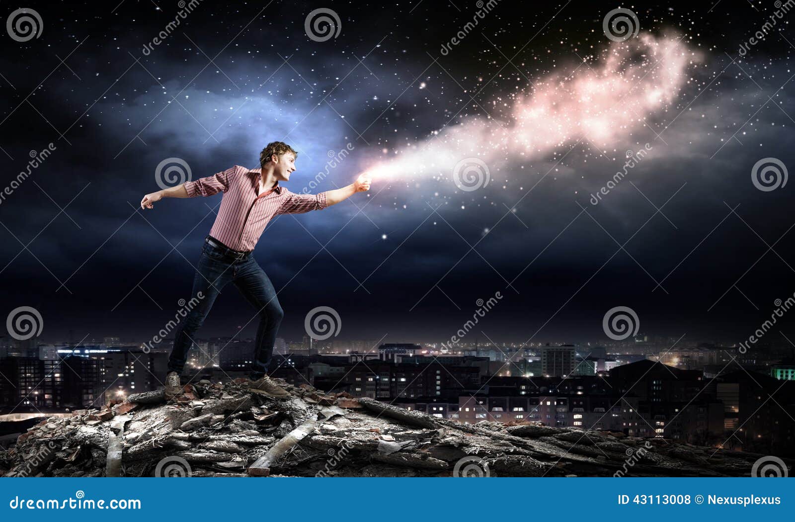 Supernormal man. Young man in casual throwing fire ball