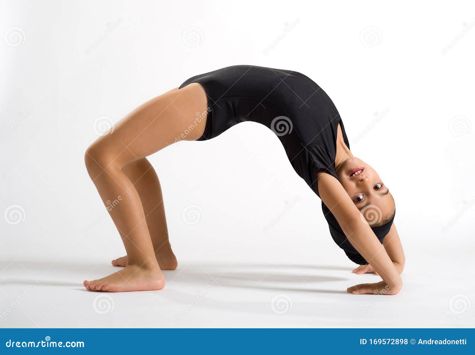 Supple Girl Bending Backwards To Form a Bridge Stock Photo - Image of ...