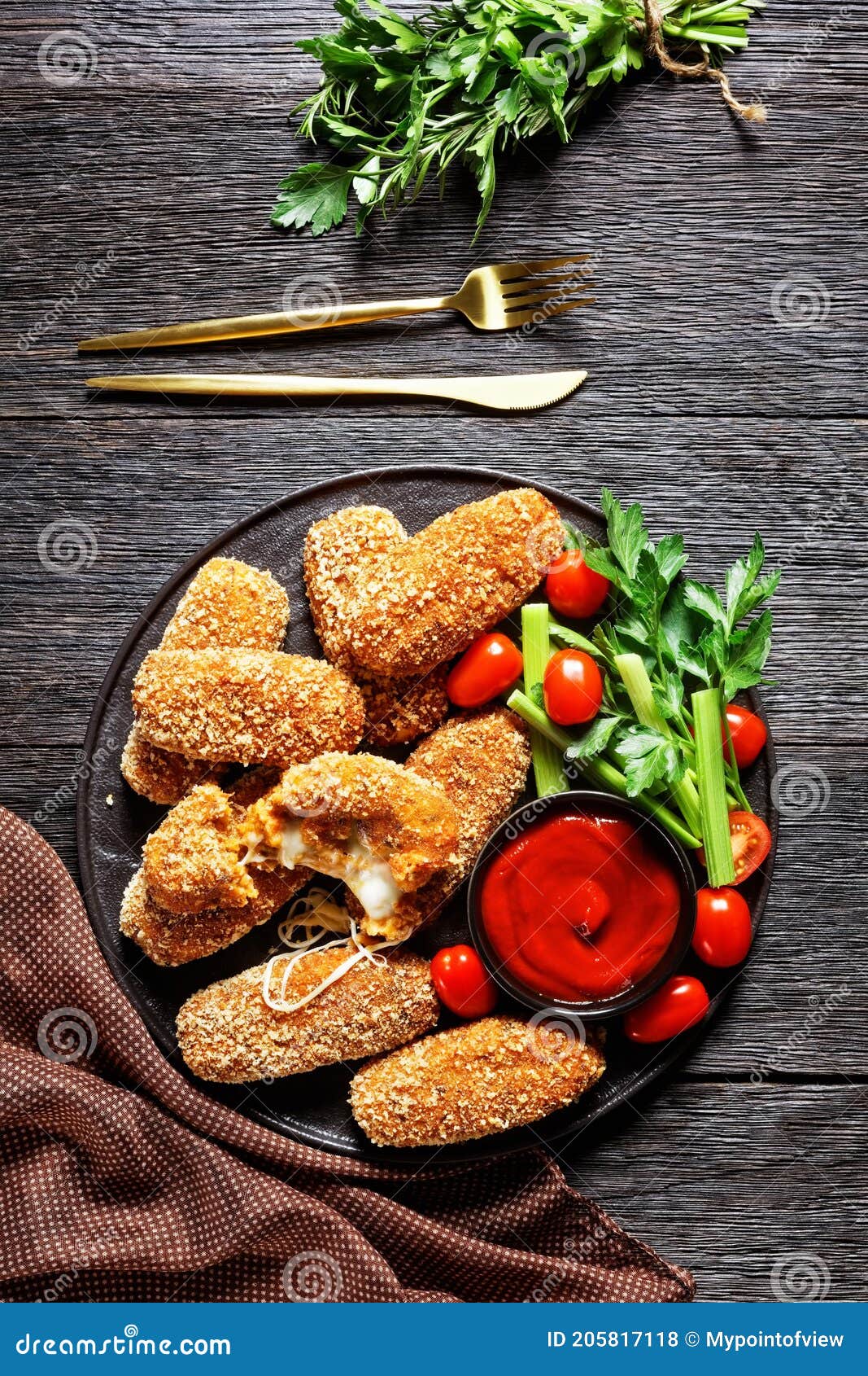 suppli al telefono on a black plate, top view