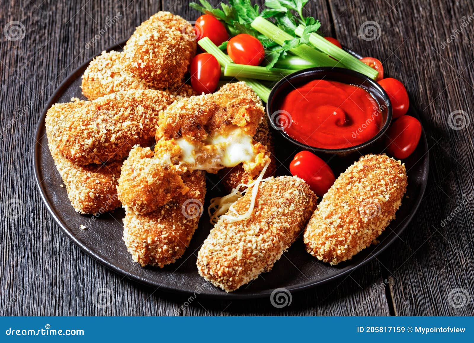 suppli al telefono on a black plate, top view