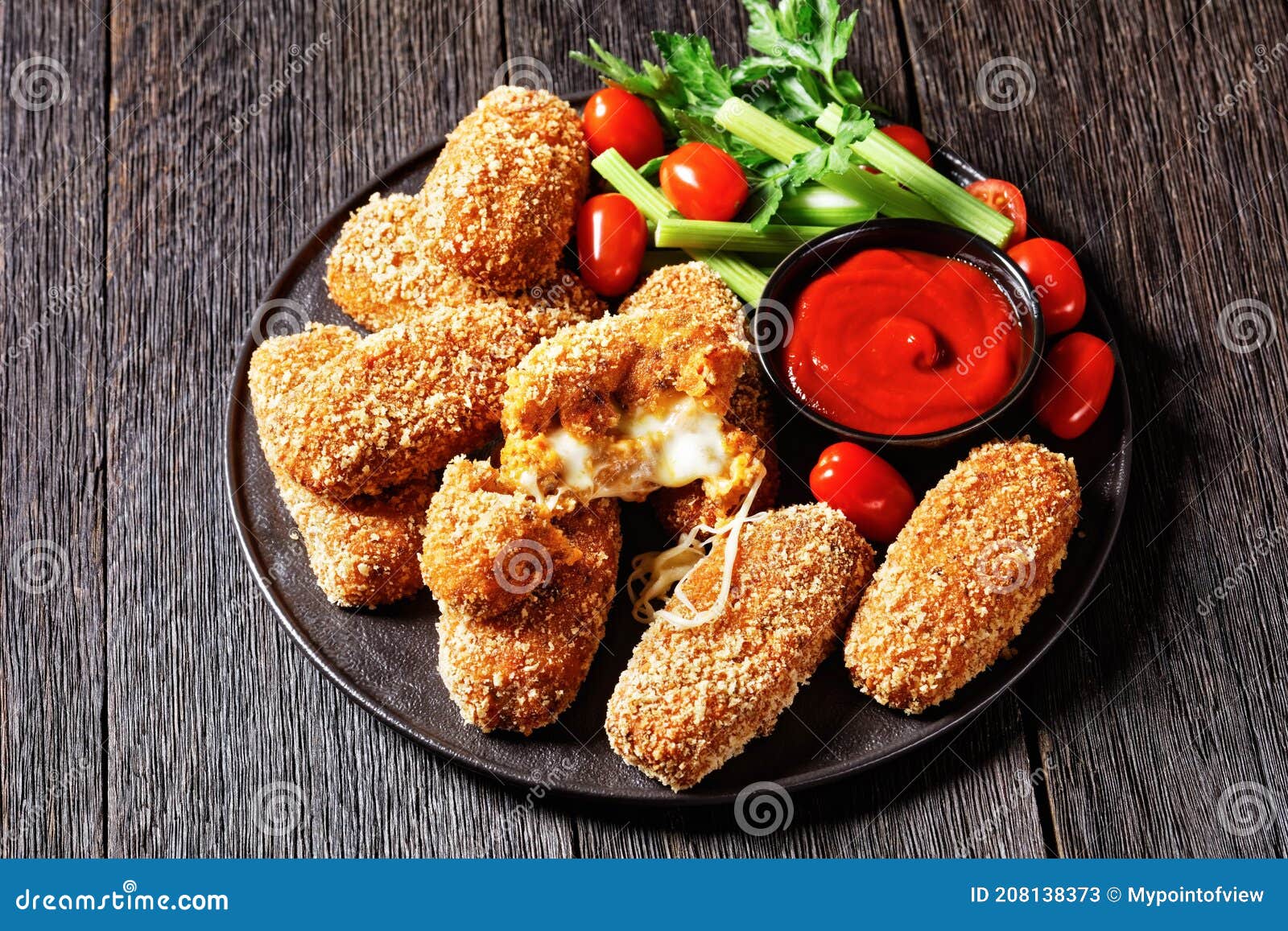 suppli al telefono on a black plate, top view