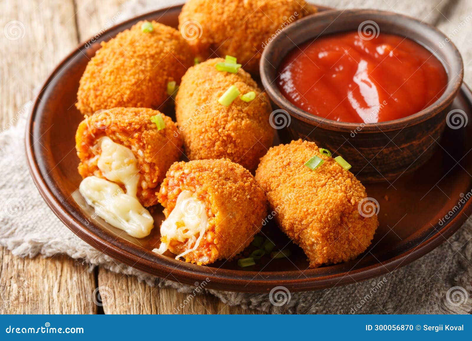 suppli al telefono italian snacks consisting of rice with tomato sauce filled with mozzarella, soaked in eggs, coated with bread
