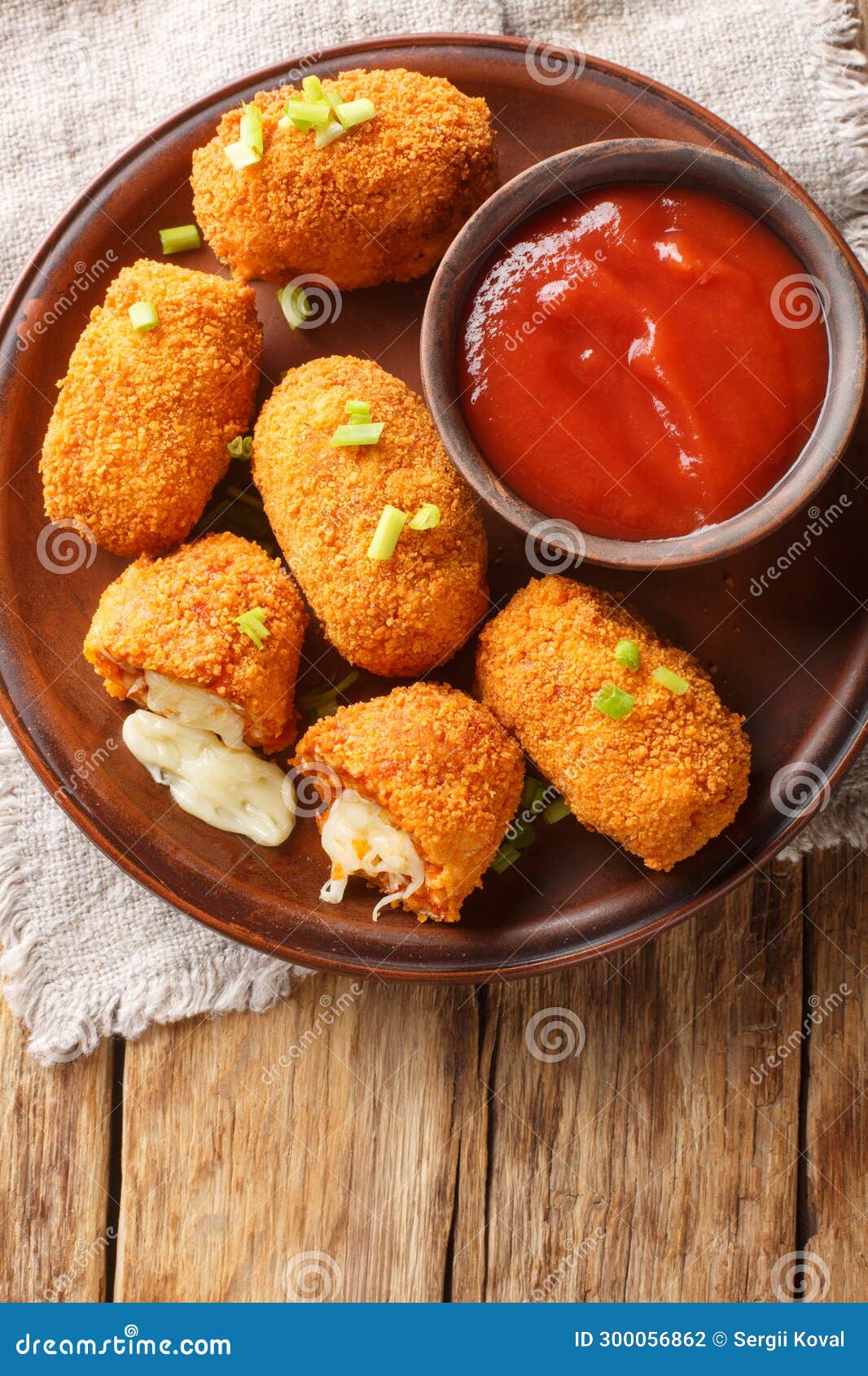 suppli al telefono from rome consists of deep-fried risotto rice with bolognese sauce and melting mozzarella closeup on the plate