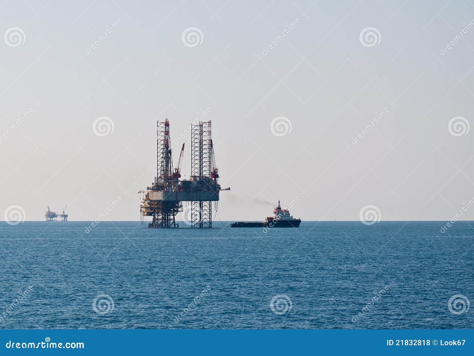 Supply vessel and oil rig stock photo. Image of boats 21832818
