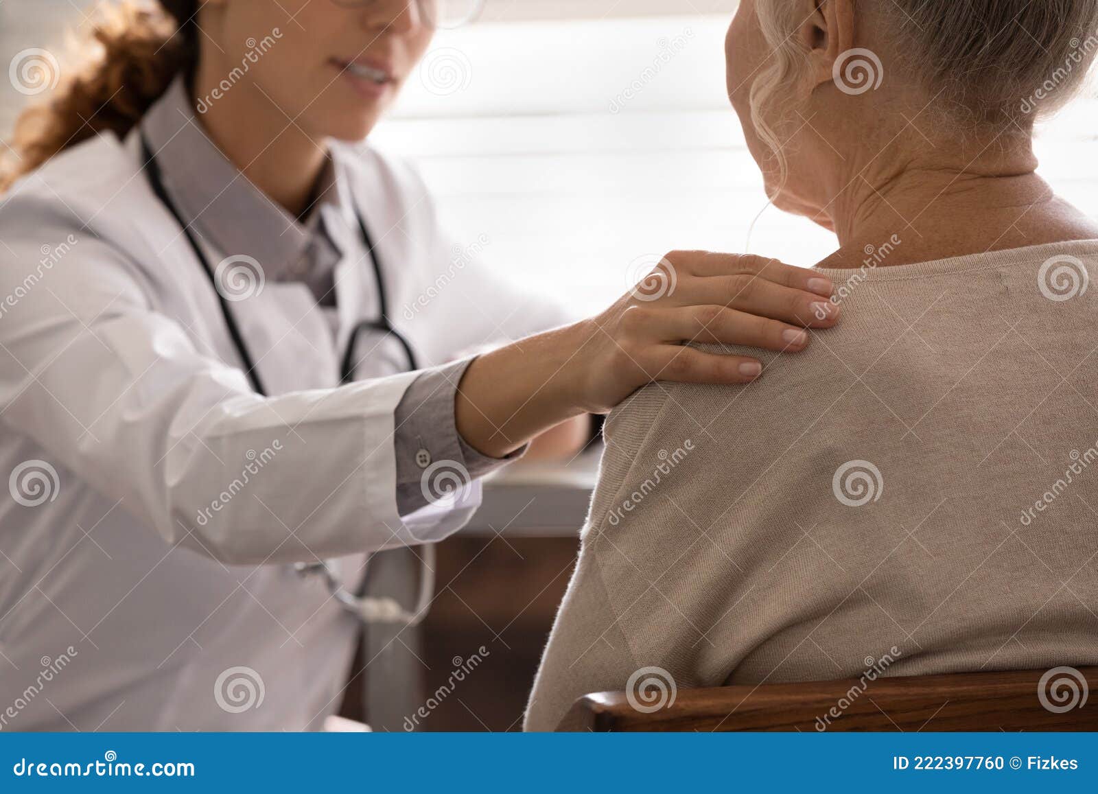 supportive female doctor comfort old woman client
