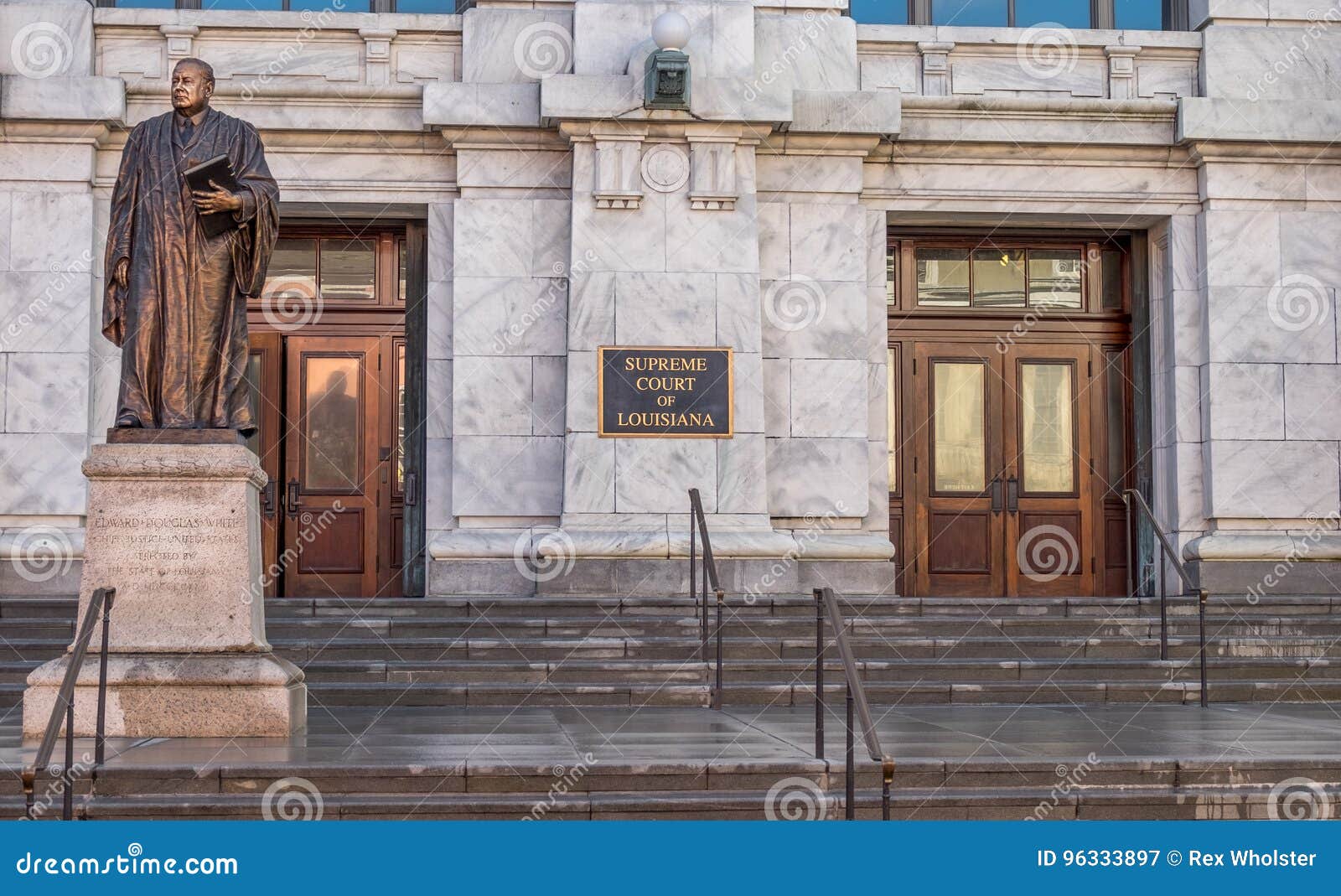 Panoramic image of Louisiana Supreme Court building with statue of