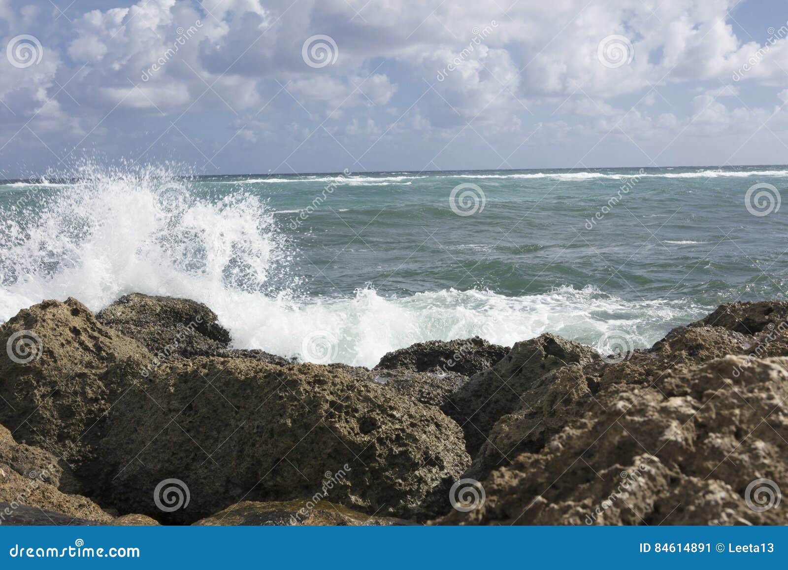 surf crashing on sea wall south inlet park boca raton florida