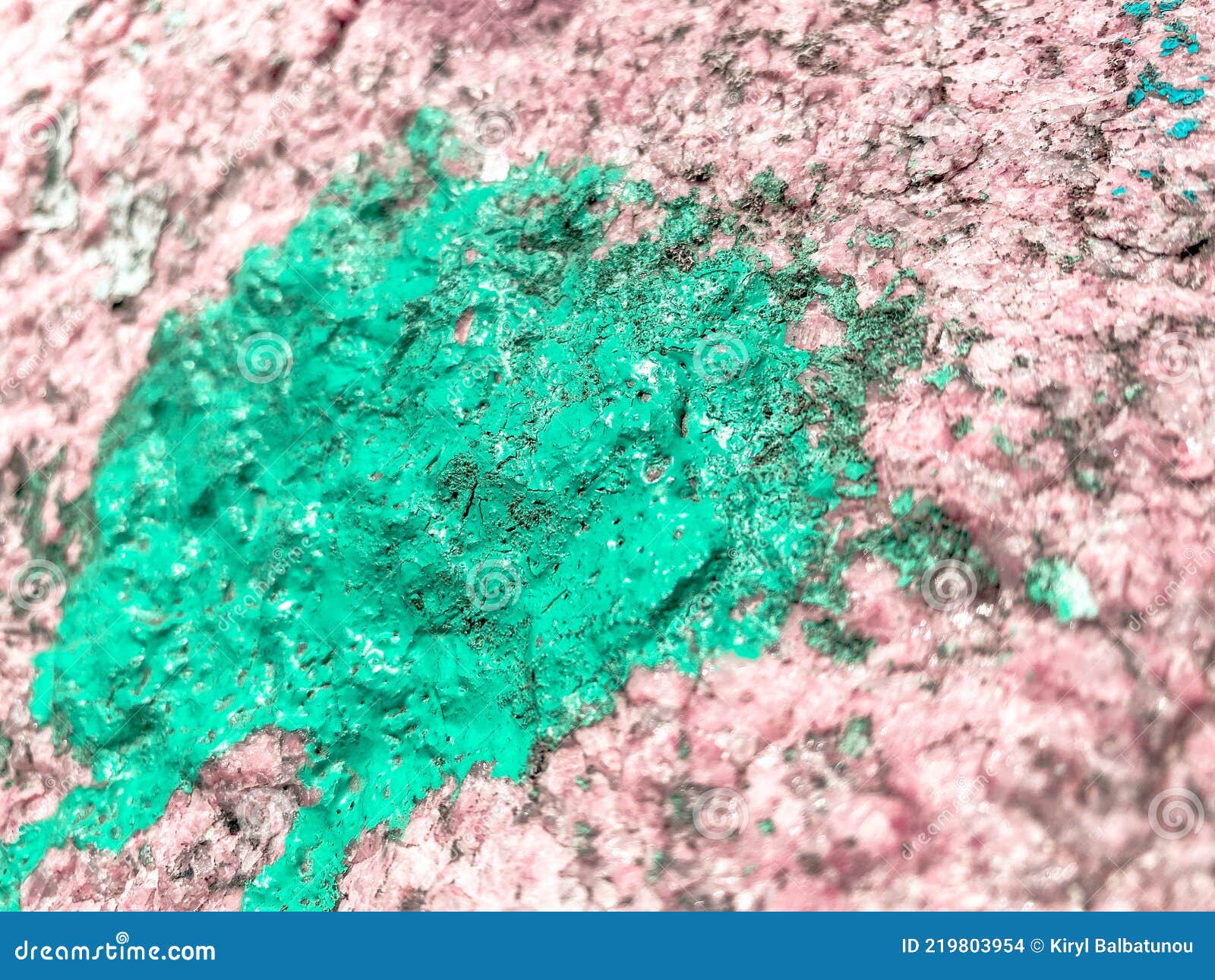 Surface Texture of Strong Natural Stone Painted with Green Paint. the