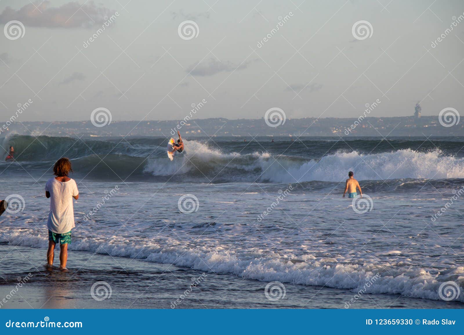 Surfer At Canggu Echo Beach In Bali Indonesia Riding Wave Editorial