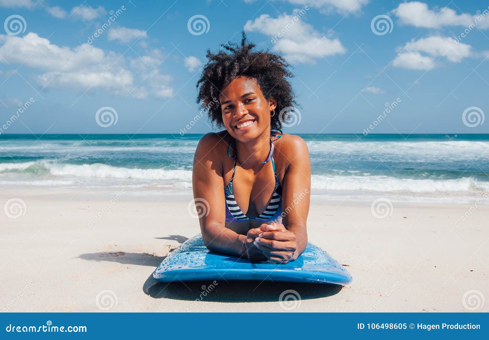 Surfer Girl with Afro Hairstyle Smiling, Lying Down on Blue Surfboard Stock Image - Image of exercise, afro: 106498605 Surfer Girl with Afro Hairstyle Smiling, Lying Down on Blue Surfboard Stock Image - Image of exercise, afro: 106498605