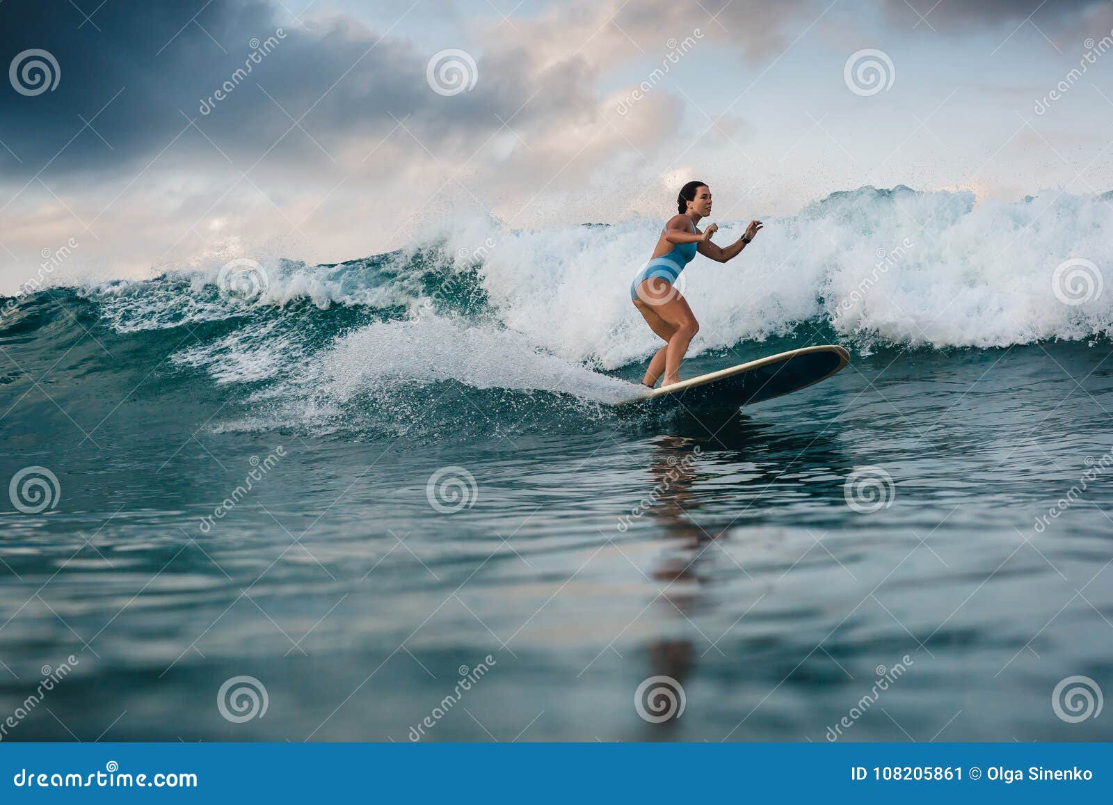 Young Woman in Bright Bikini Surfing on a Board in Ocean Stock Image ...