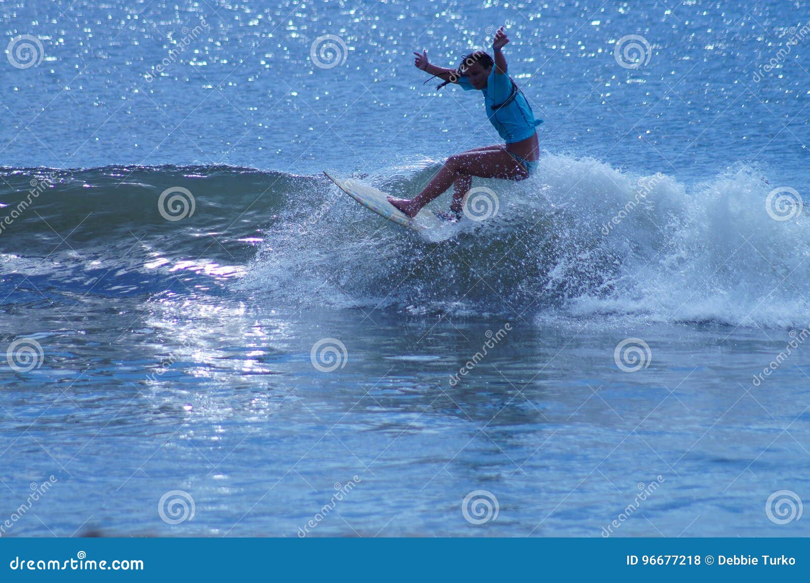 Surfer Girl Carving a Wave in the Outer Banks of NC Stock Photo - Image ...