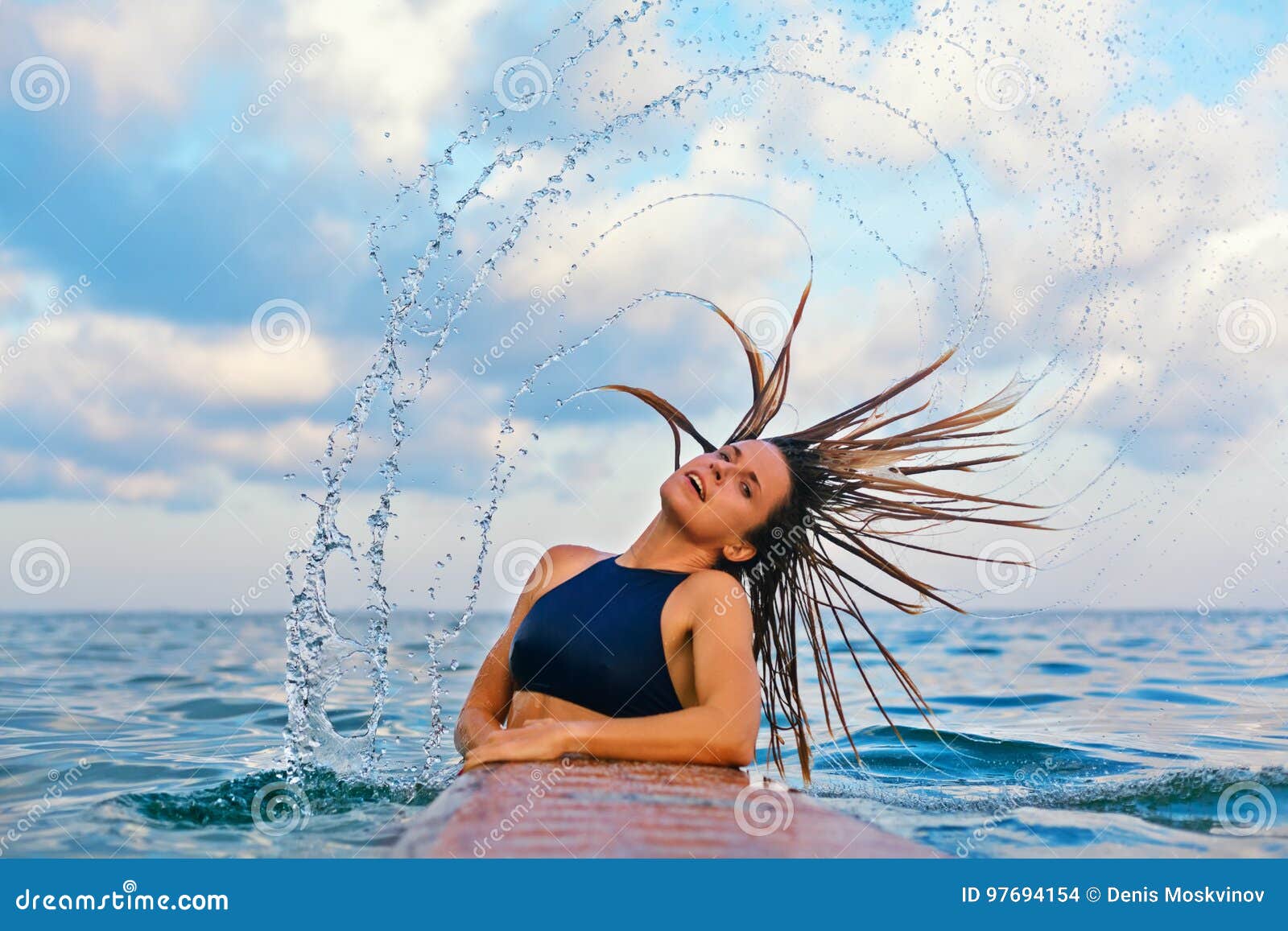 Premium Photo | Portrait a beautiful surfer mixed-race girl with wet hair  at the beach in a profile holding her white surfboard