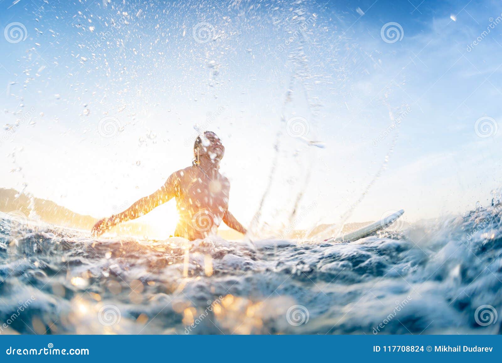 Surfer Haves Fun And Makes Water Splashes Stock Photo
