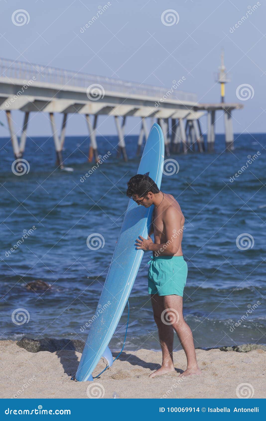 Surfer Holding His Blue Surfboard from Behind Stock Photo - Image of ...