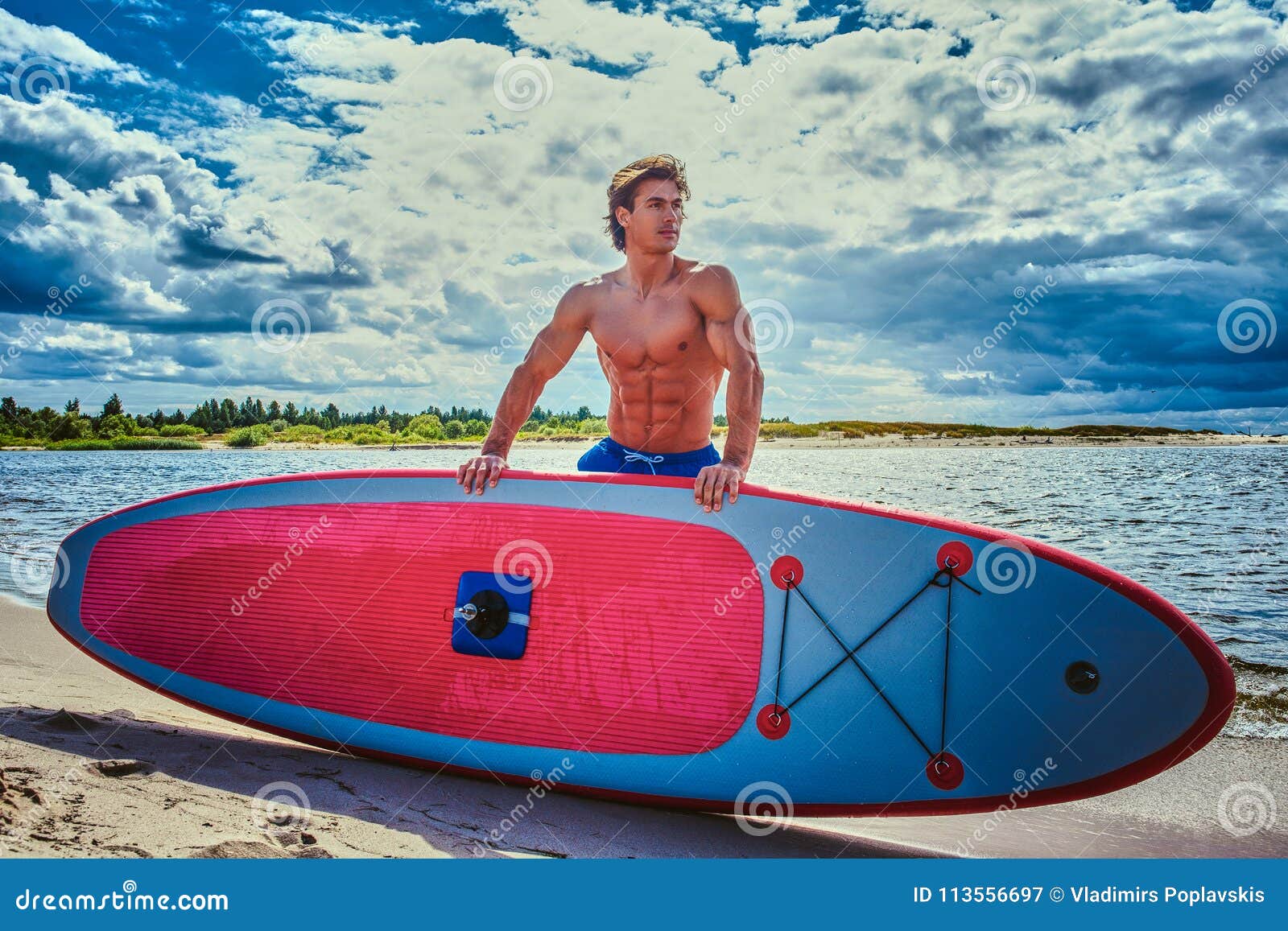 Surfer Male With A Muscular Body With His Surfboard At The ...