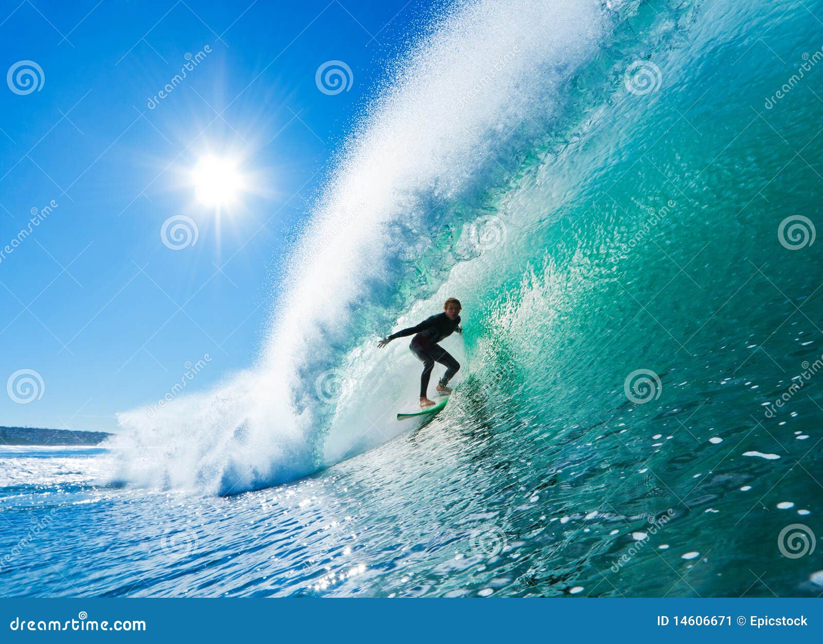 surfer on perfect wave getting barreled