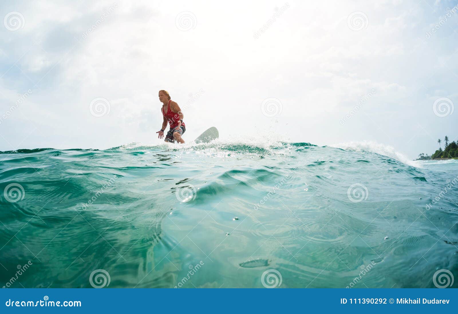 Surfer rides the wave stock photo. Image of sporty, ocean - 111390292