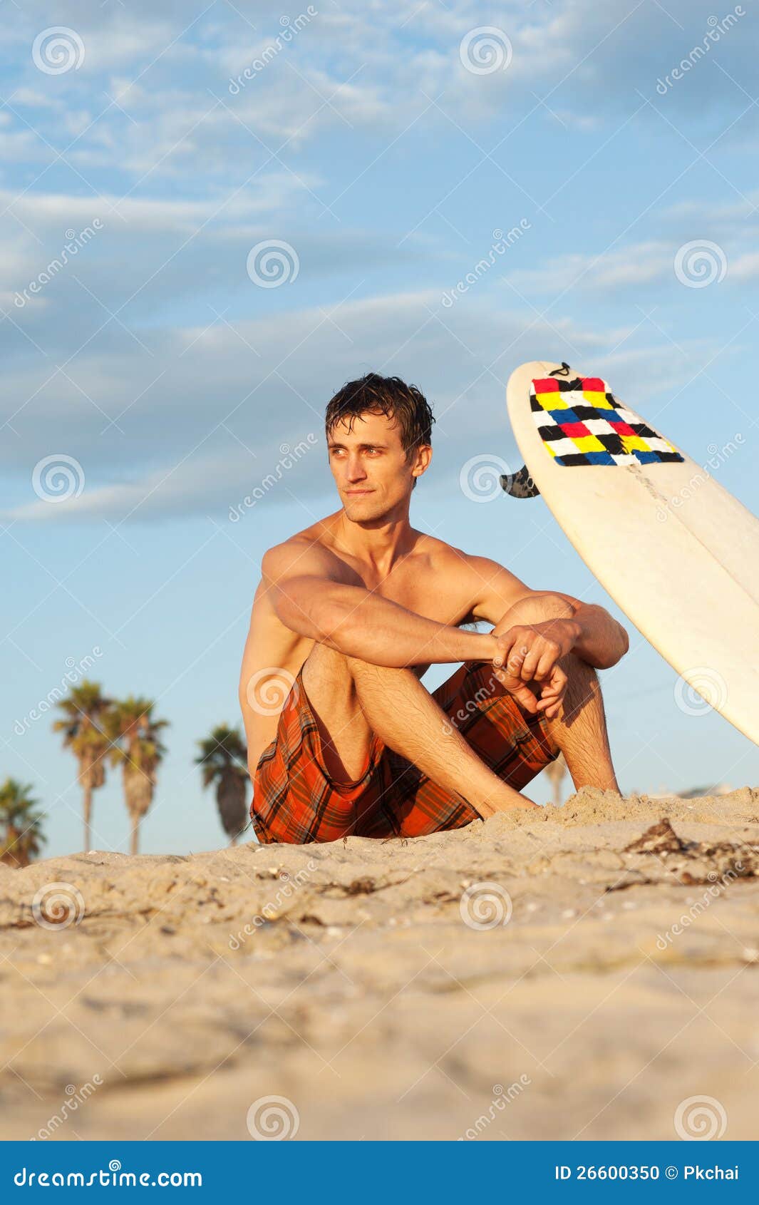 Surfer Sitting on the Beach with Surfboard Stock Photo - Image of ...