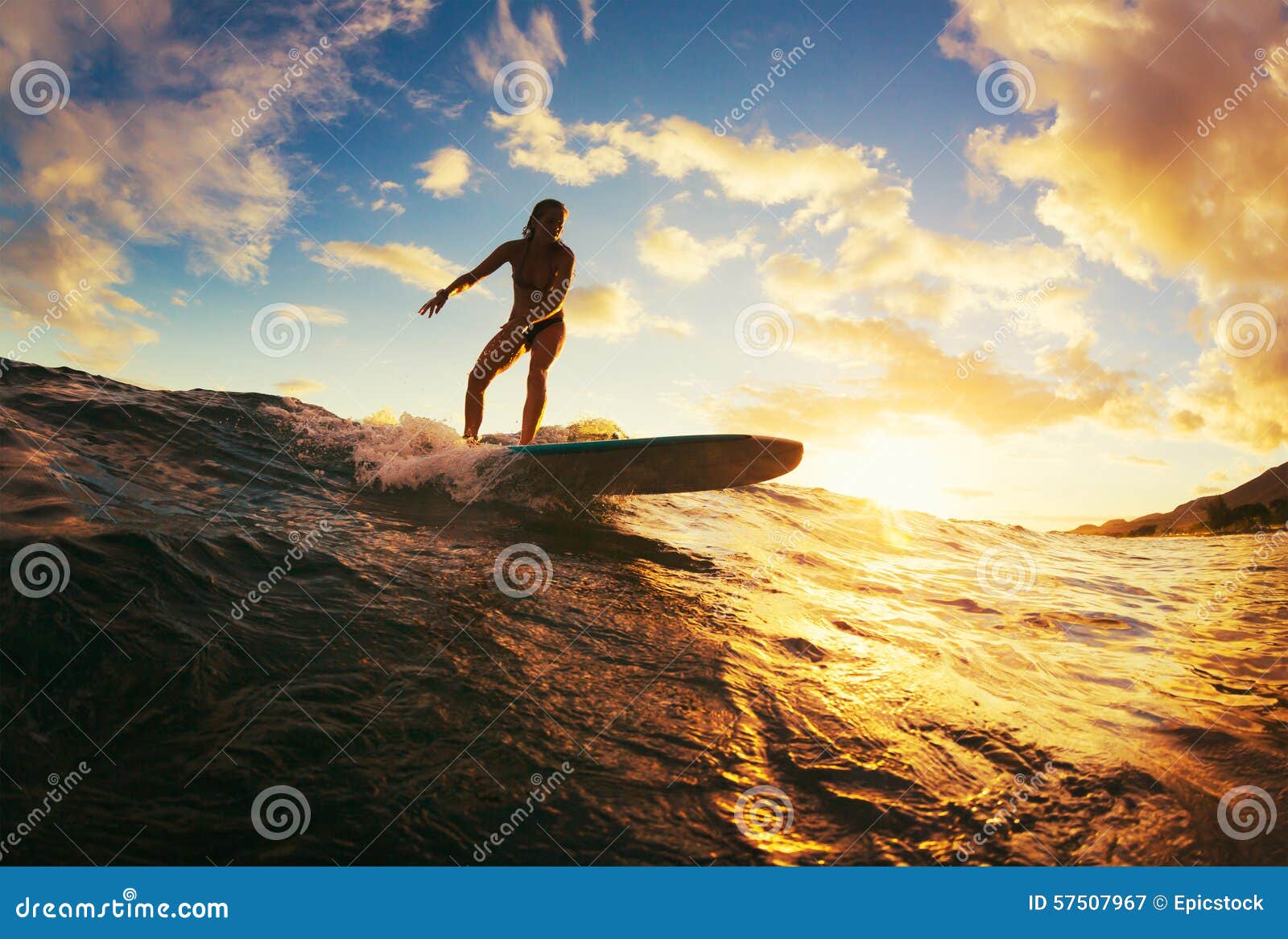 surfing at sunset