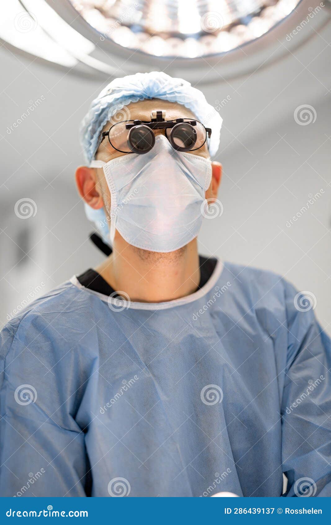 Surgeon with Microscope Glasses during an Operation Stock Image Image