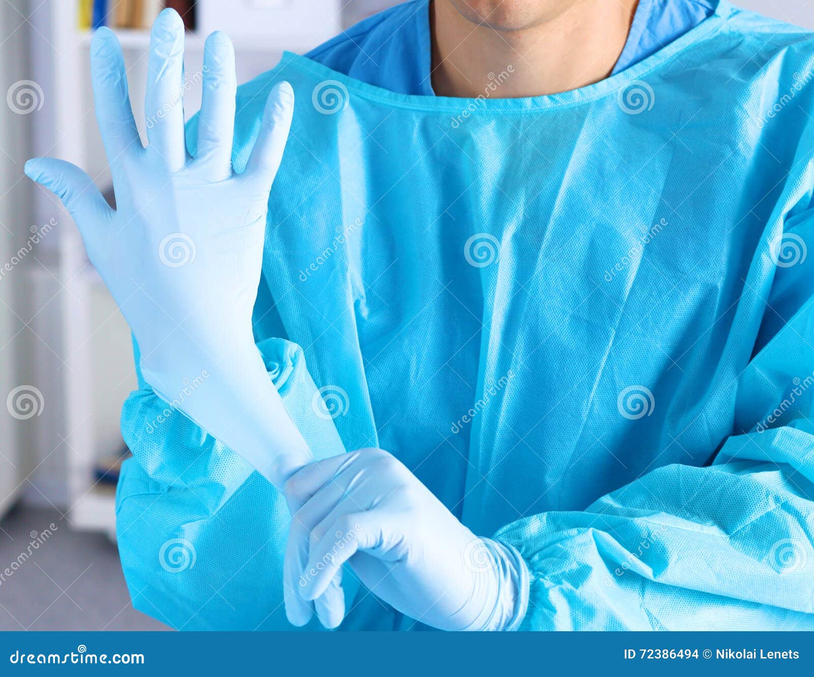 Surgeon Putting on Gloves before a Closeup Operation Stock Photo