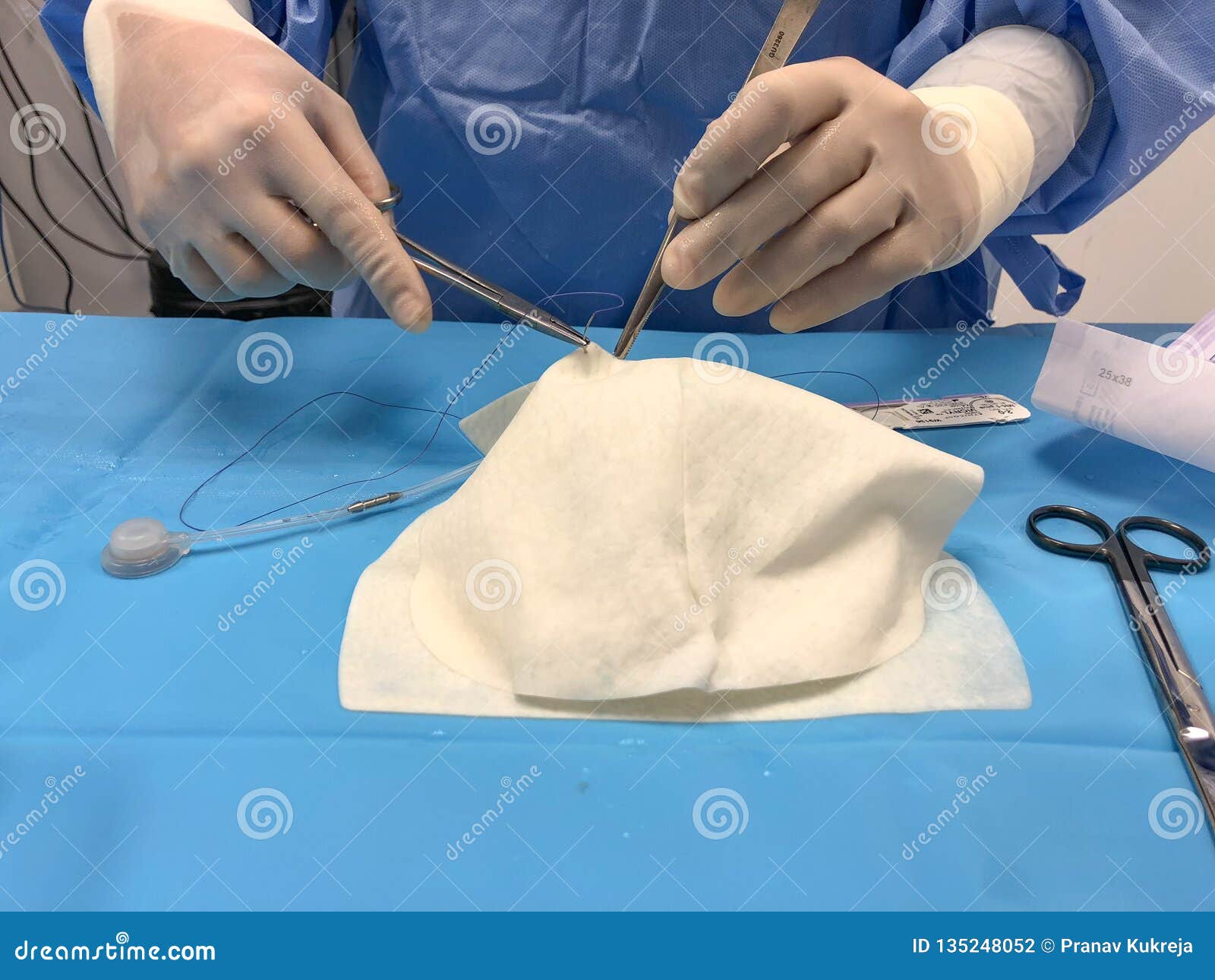Surgeon`s Hands Suturing on a Sterile Table. Stock Photo Image of