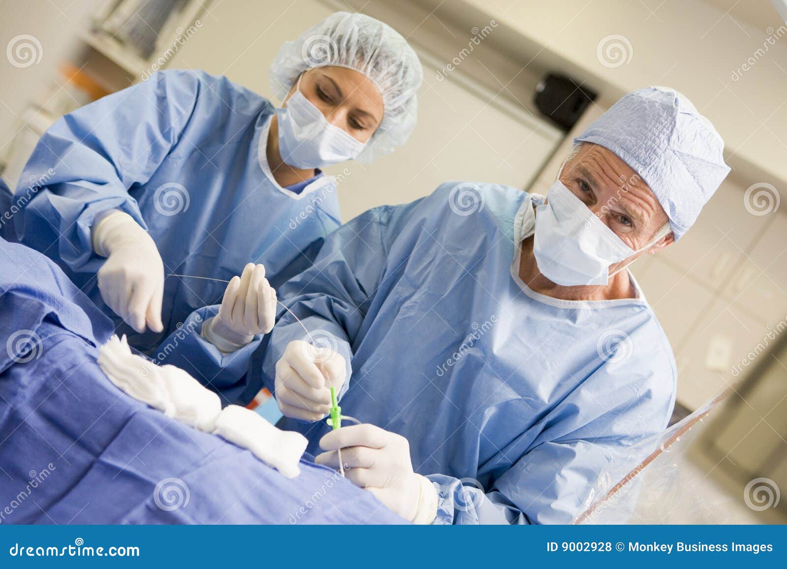 Surgeons Preparing Equipment for Surgery Stock Photo Image of