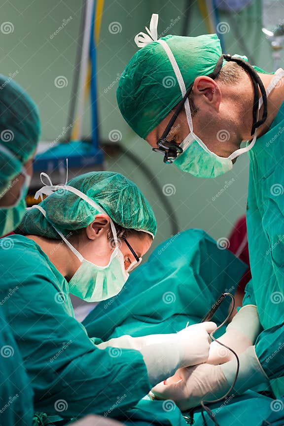 Surgeons Team with Electronic Scalpel Stock Photo Image of healthcare