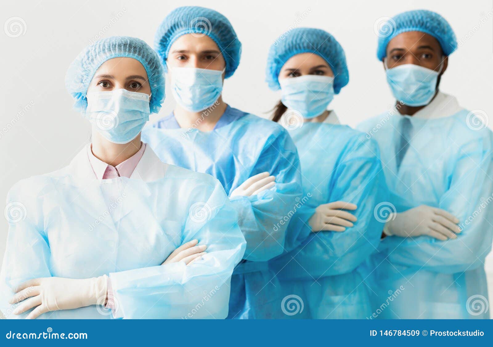 Surgeons Team Wearing Protective Uniforms, Standing in Row Stock Image