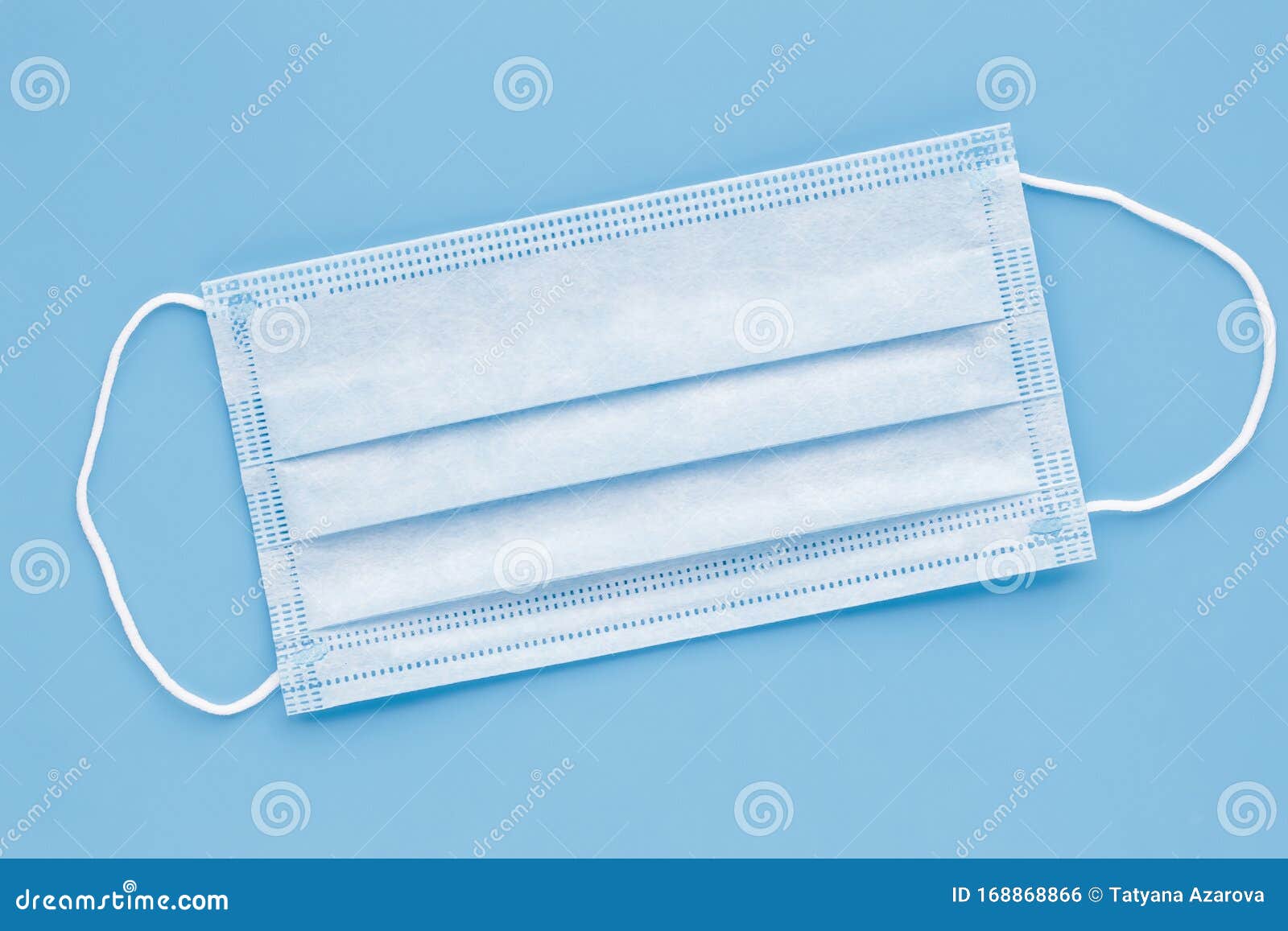 surgical mask with rubber ear straps. typical 3-ply surgical mask to cover the mouth and nose. procedure mask from bacteria.