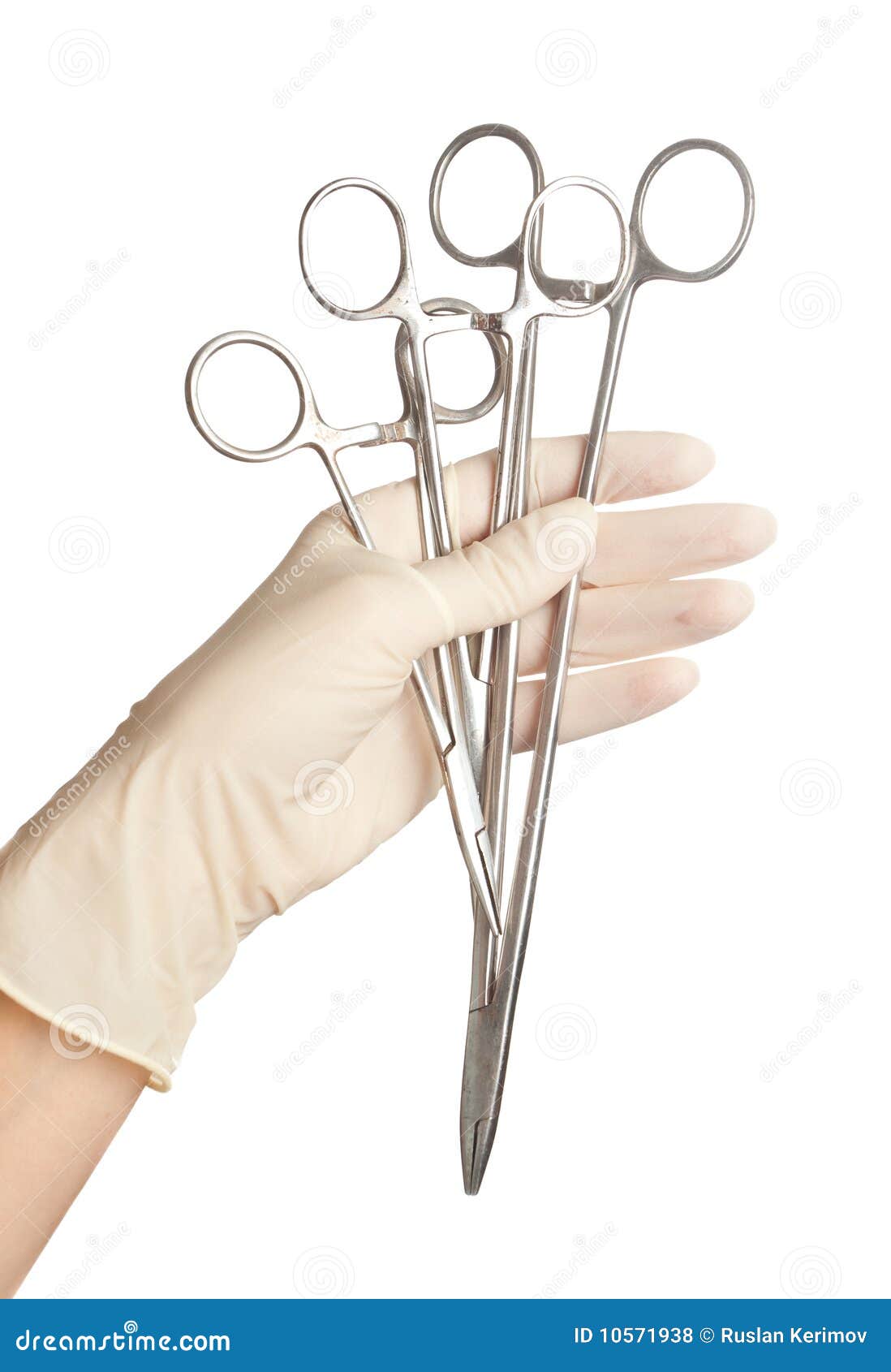 Surgical tools in a hand stock photo. Image of medicinal 10571938