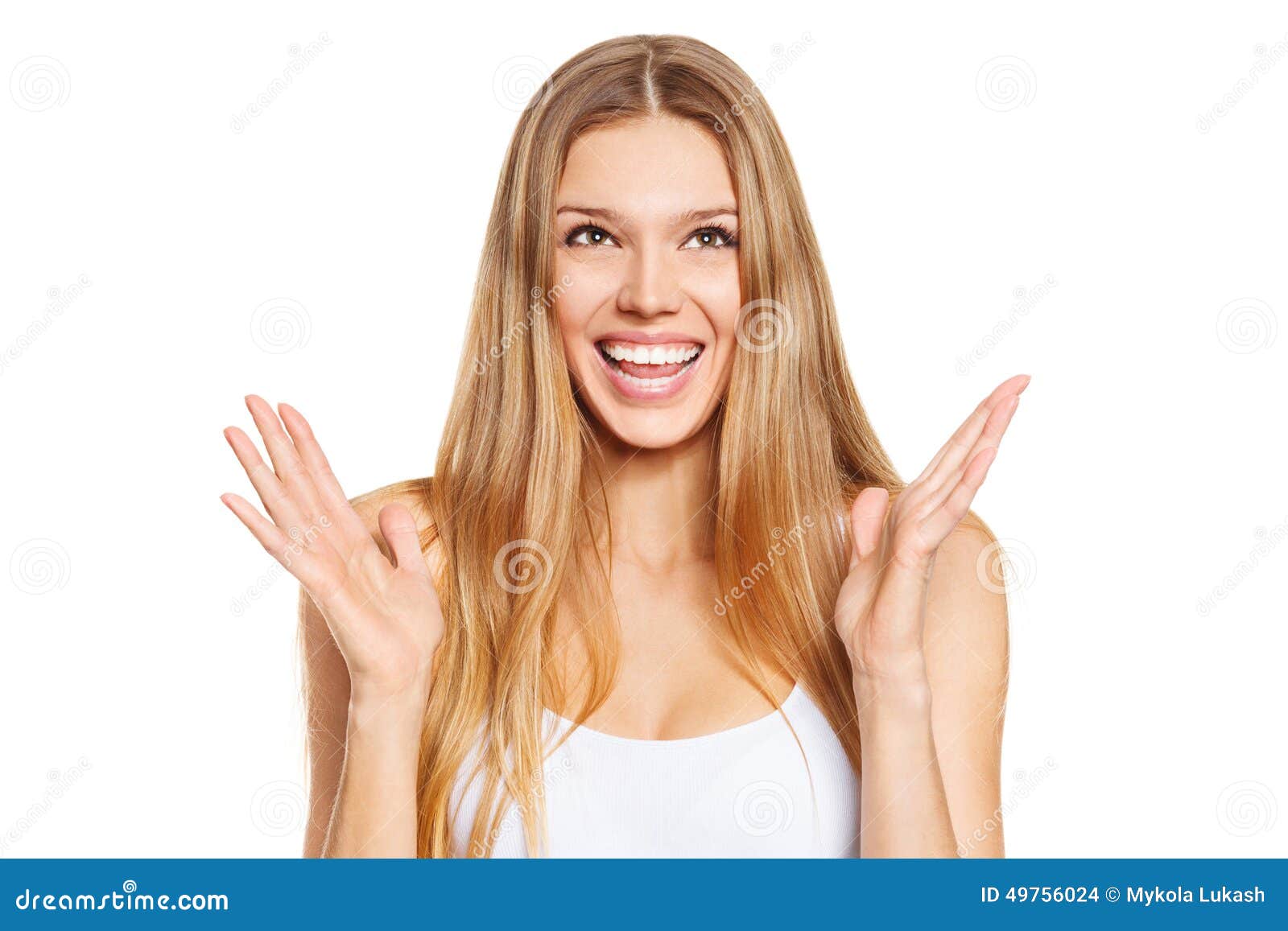 surprised happy beautiful young woman looking up in excitement.  over white