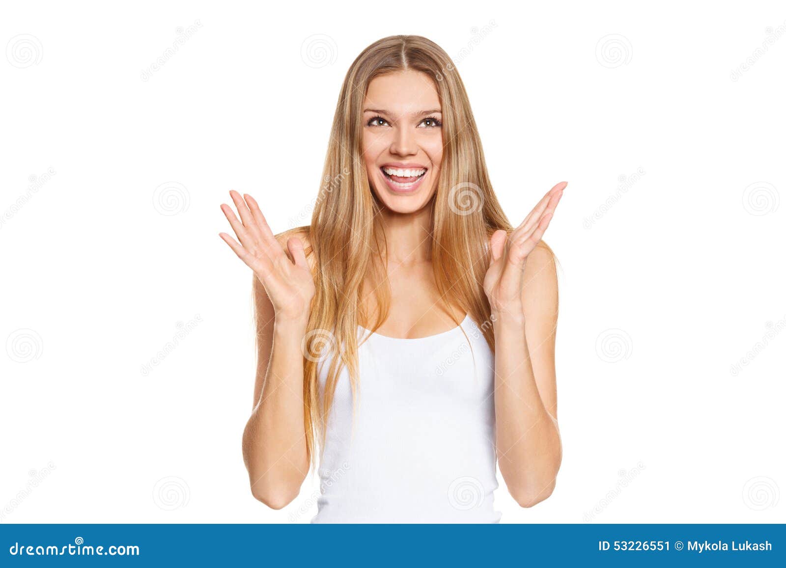 surprised happy beautiful young woman looking up in excitement.  over white