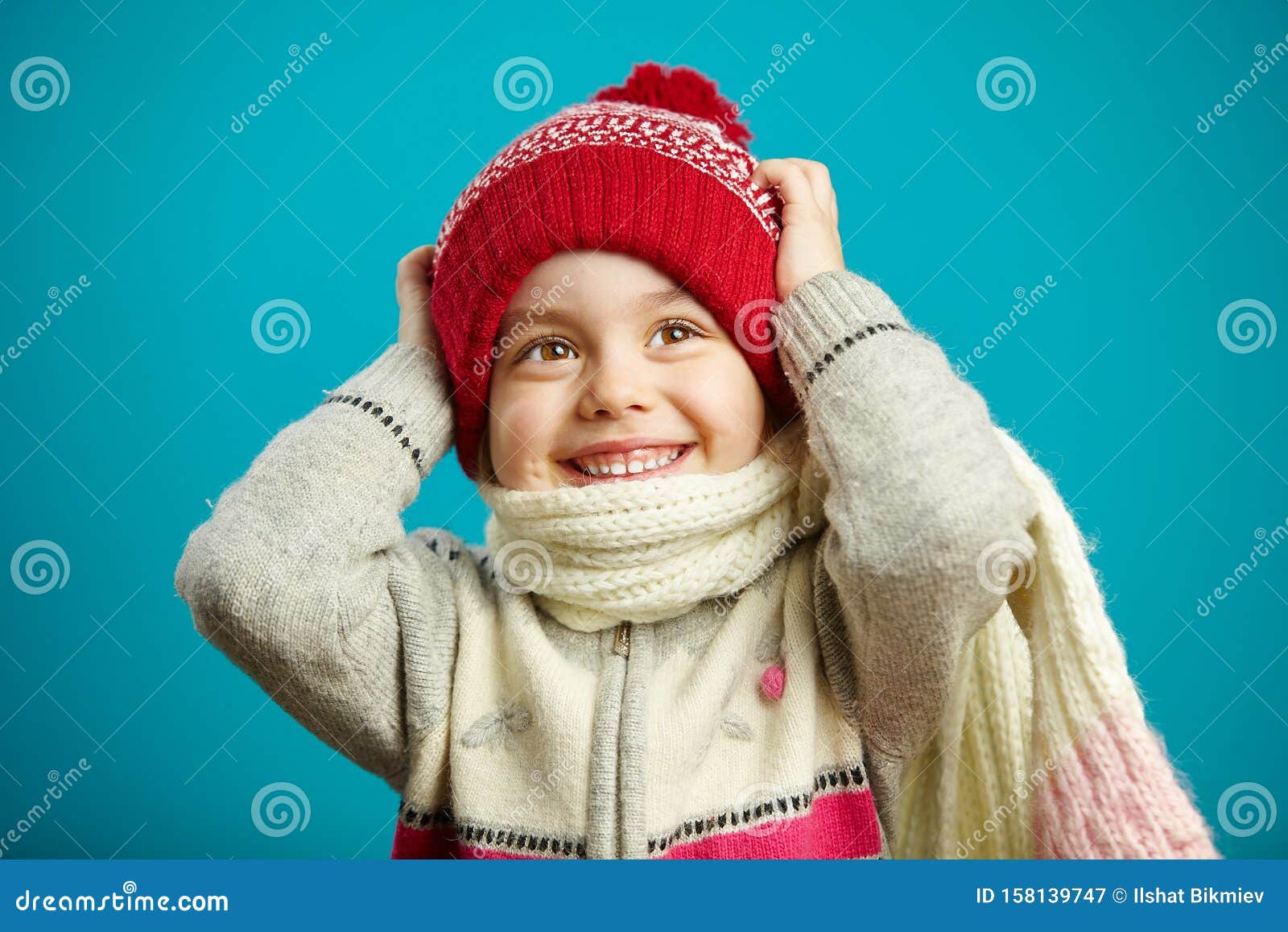 Surprised Little Girl in the Christmas Hat Grabbed Her Head, Expresses ...