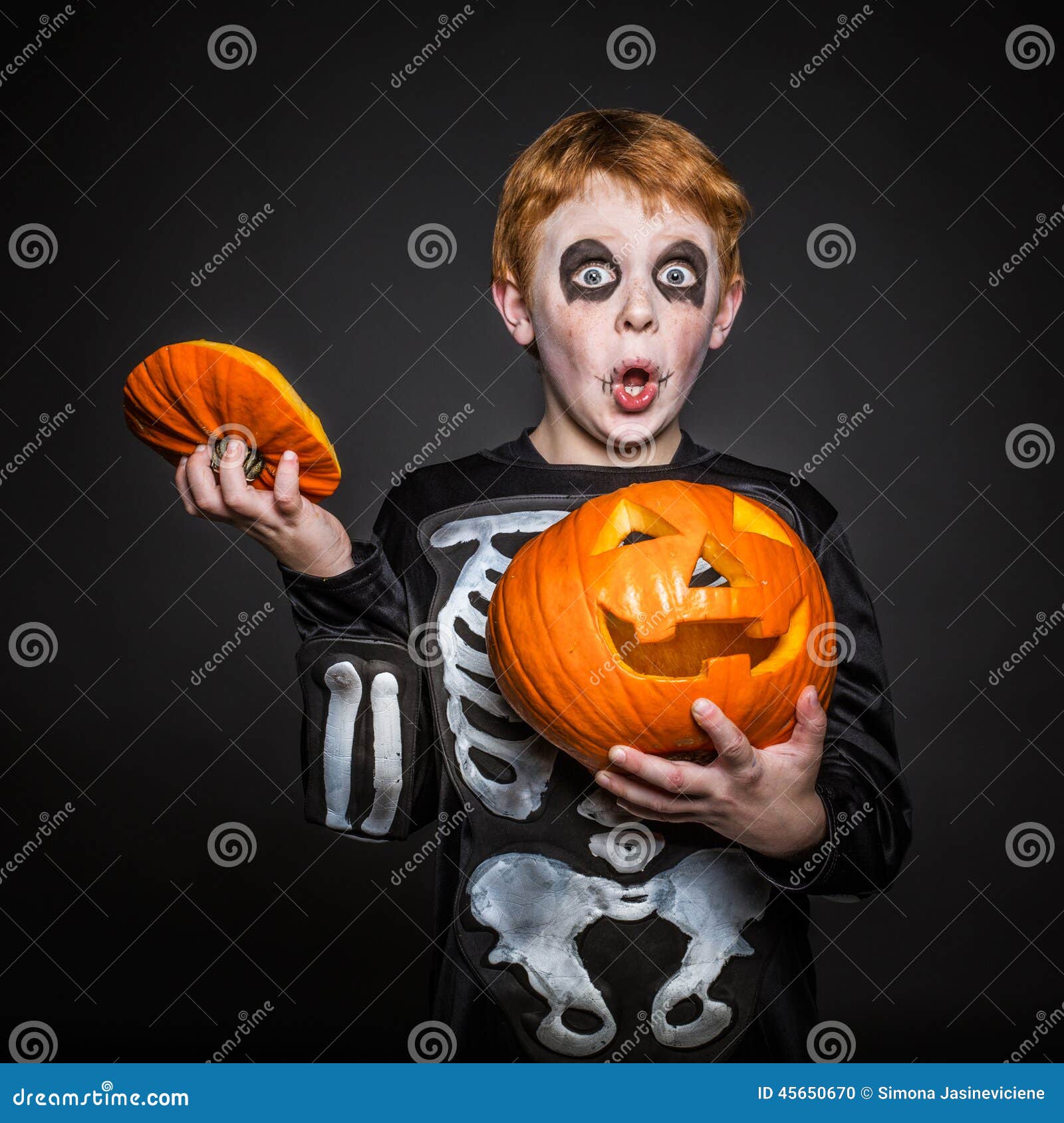 Surprised Red Hair Kid in Halloween Costume Holding a Orange Pumpkin ...