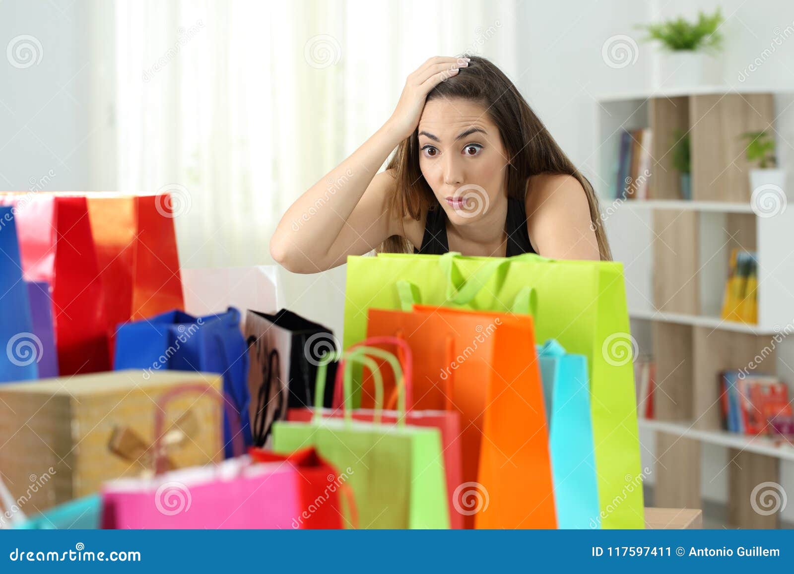 surprised woman looking at multiple purchases
