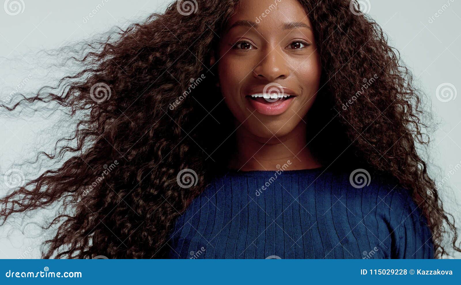 Beauty Black Mixed Race African American Woman With Long Curly Hair And Perfect Smile