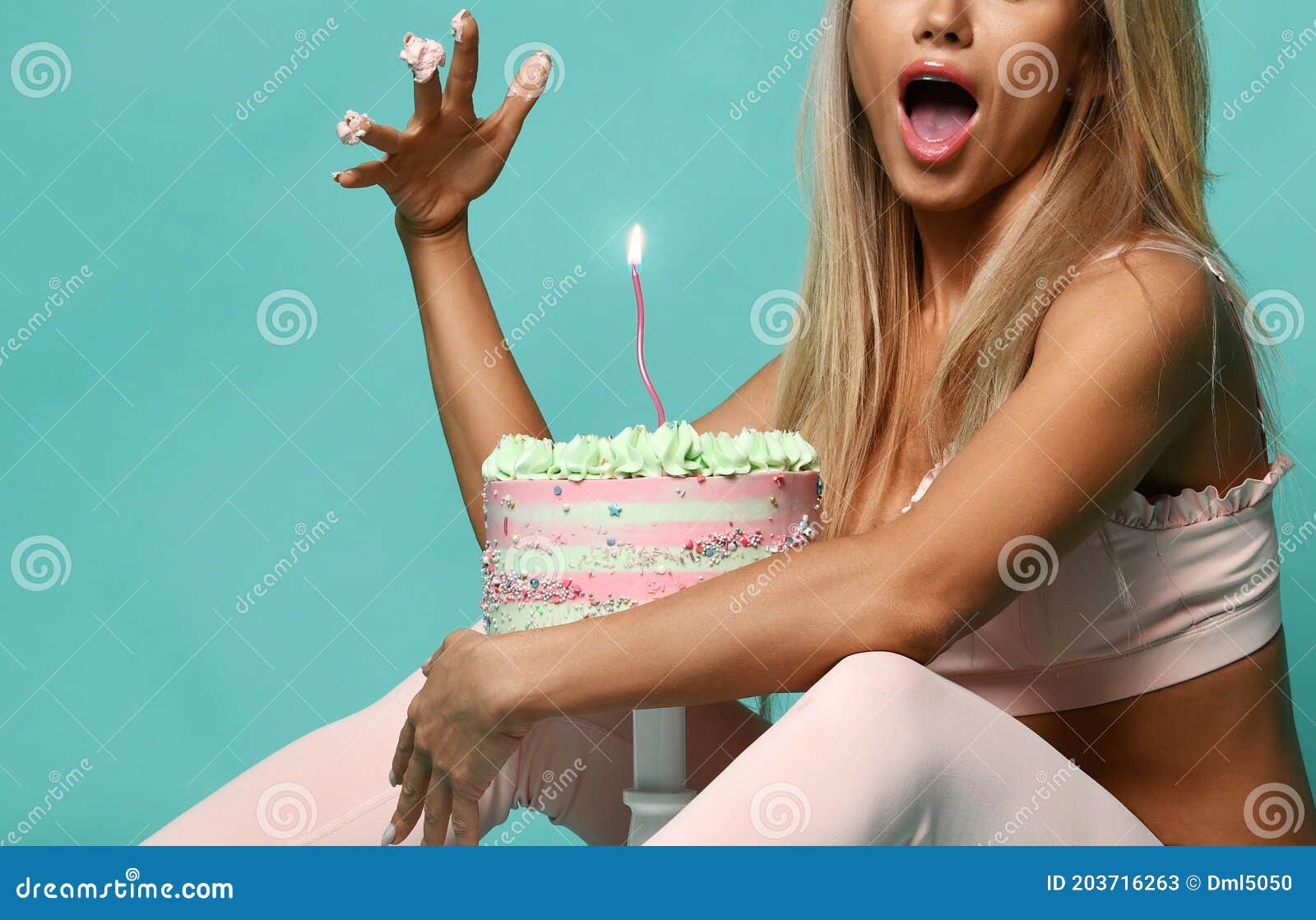 https://thumbs.dreamstime.com/z/surprised-young-beautiful-sexy-blonde-fitness-woman-bra-pants-sitting-eating-cream-birthday-holiday-cake-hand-203716263.jpg