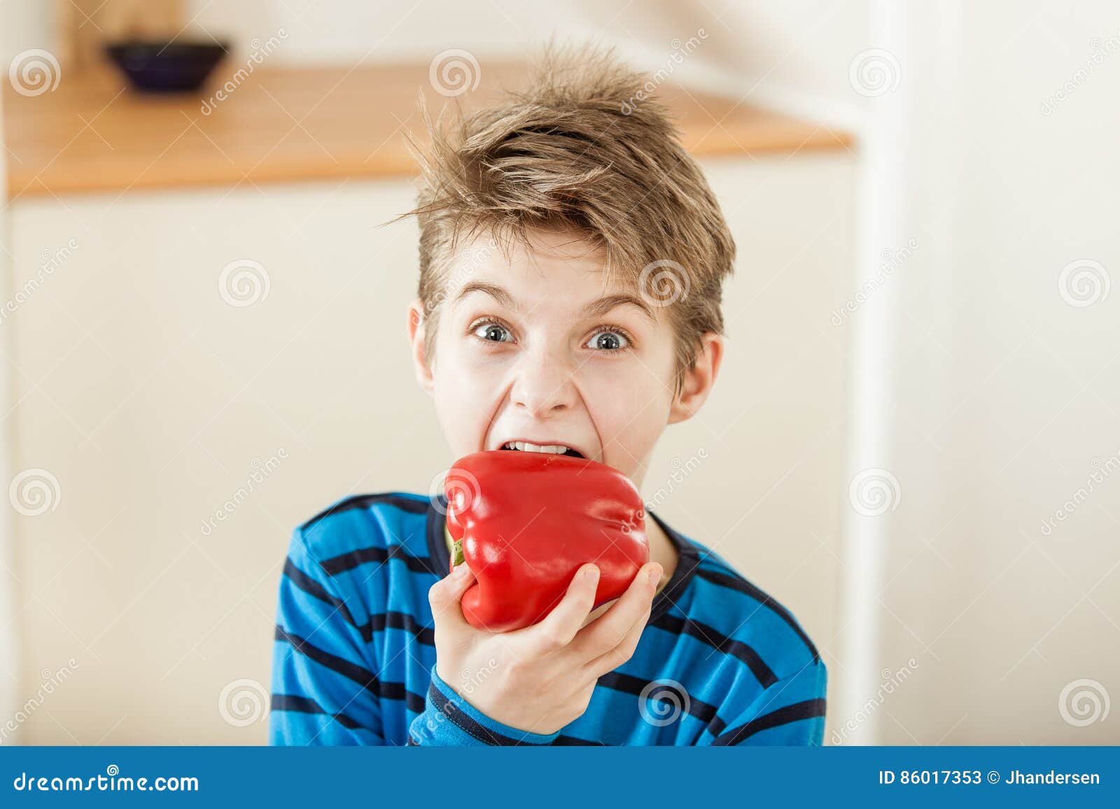 Surprised Young Boy Biting into a Red Bell Pepper Stock Image - Image of mouth, eating: 86017353