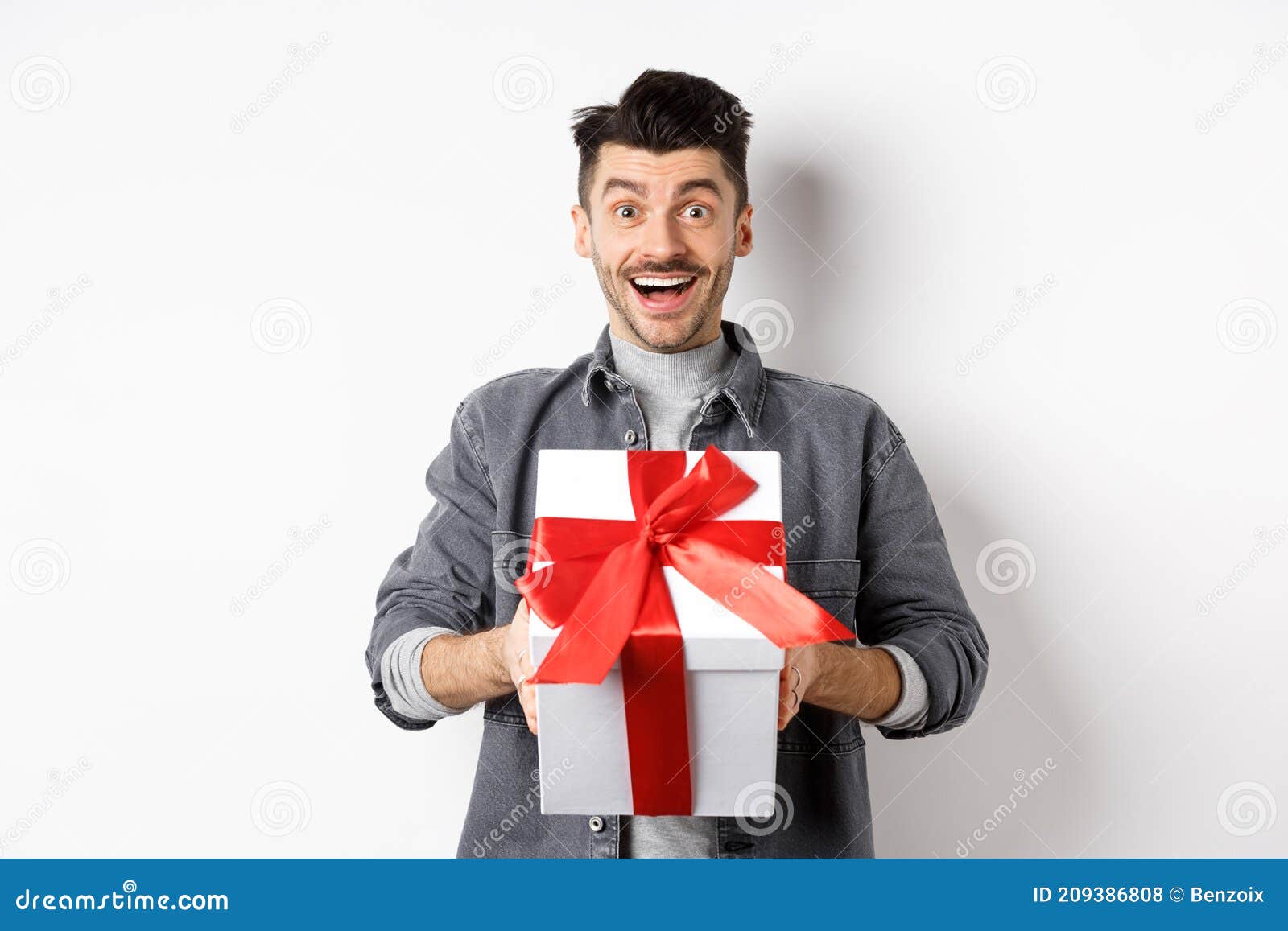 Surprised Young Man Smiling Excited, Holding Big Gift Box on Valentines ...