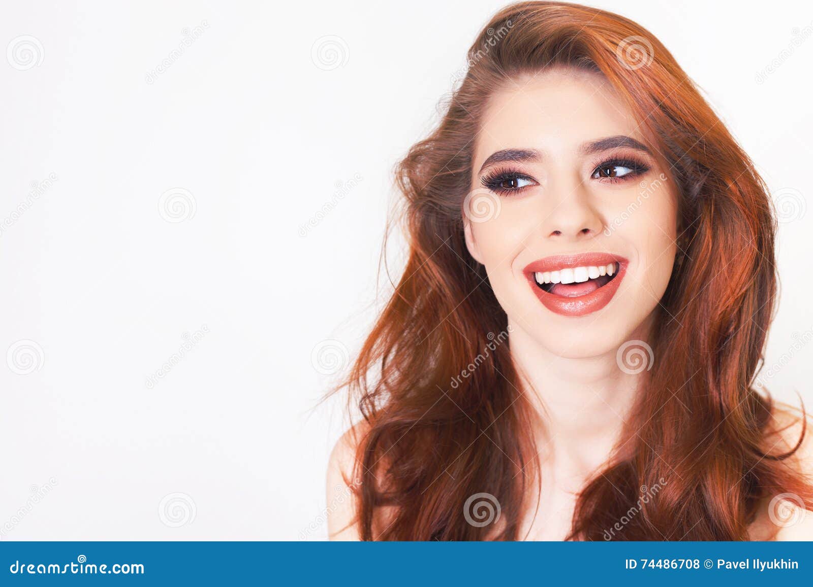 surprised young woman with healthy perfect hair and white smile