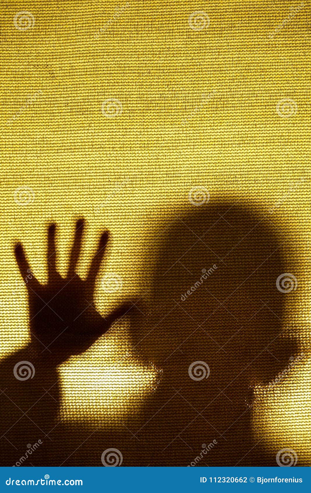 surreal image of a man trapped behind a fabric.