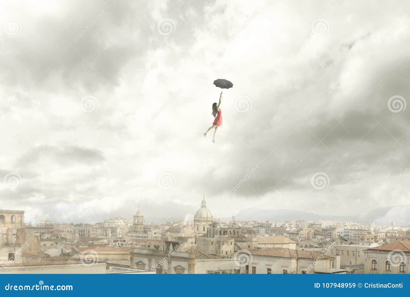 surreal moment of a woman flying with her umbrella over the city