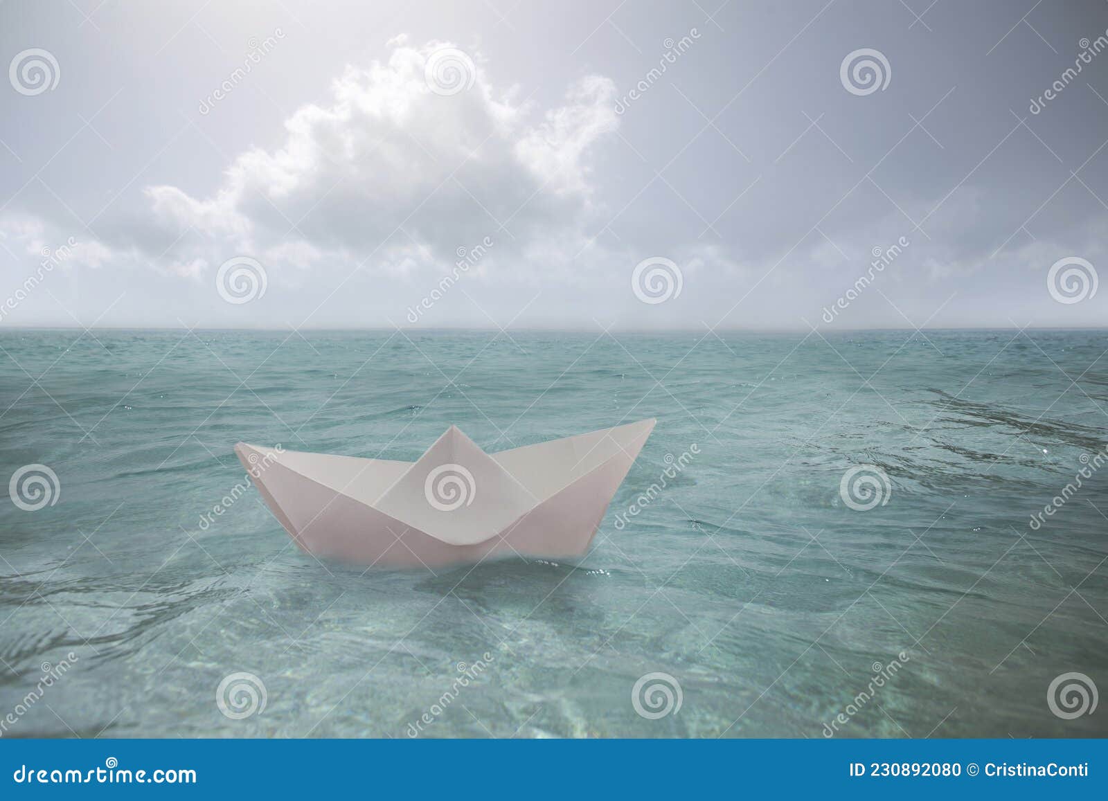 surreal paper boat travels alone in the infinite ocean