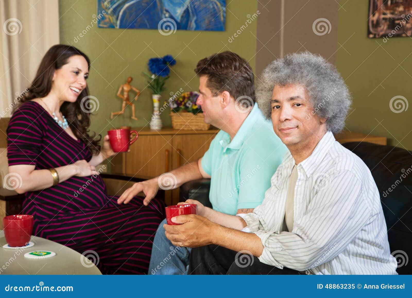 Surrogate Mother with Two Same Sex Parents Stock Image picture